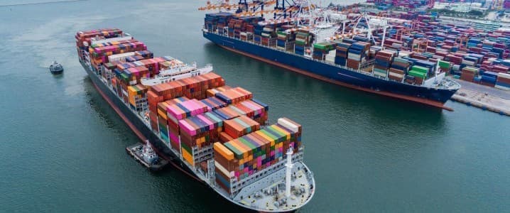 Strait of Hormuz oil tanker traffic; LNG-powered cargo ship at port; alternative marine fuel infrastructure; global shipping routes energy map